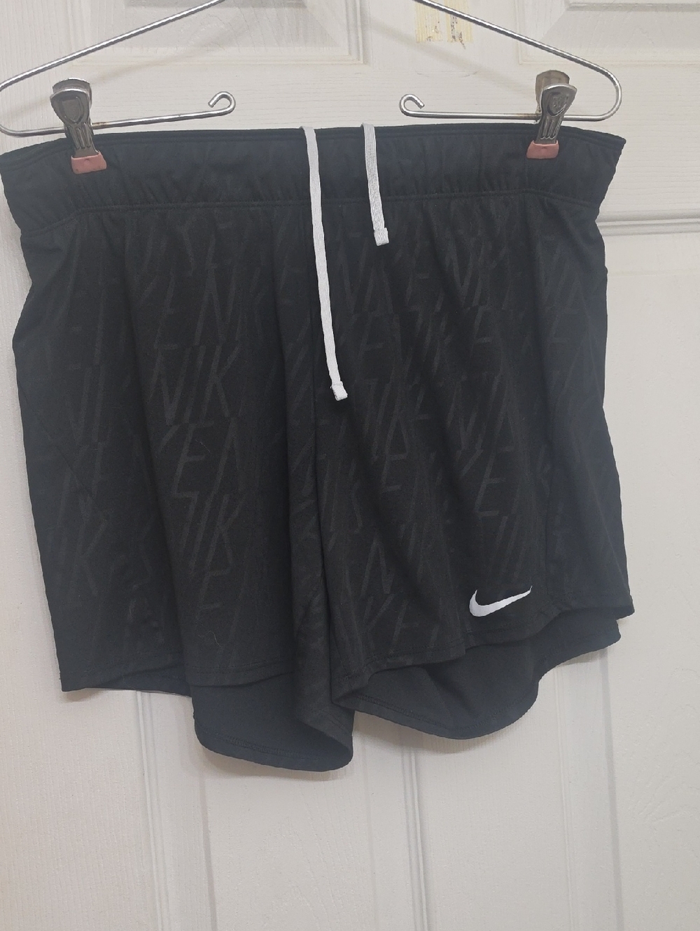 Nike Black Athletic Shorts with White Drawstring and Swoosh Accent